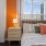 Sunlit windows with city views.