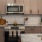 kitchen with tan cabinets and stainless steel appliances
